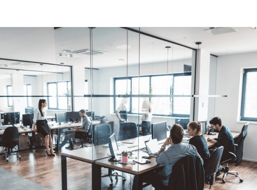 Office workspace with people working at computers